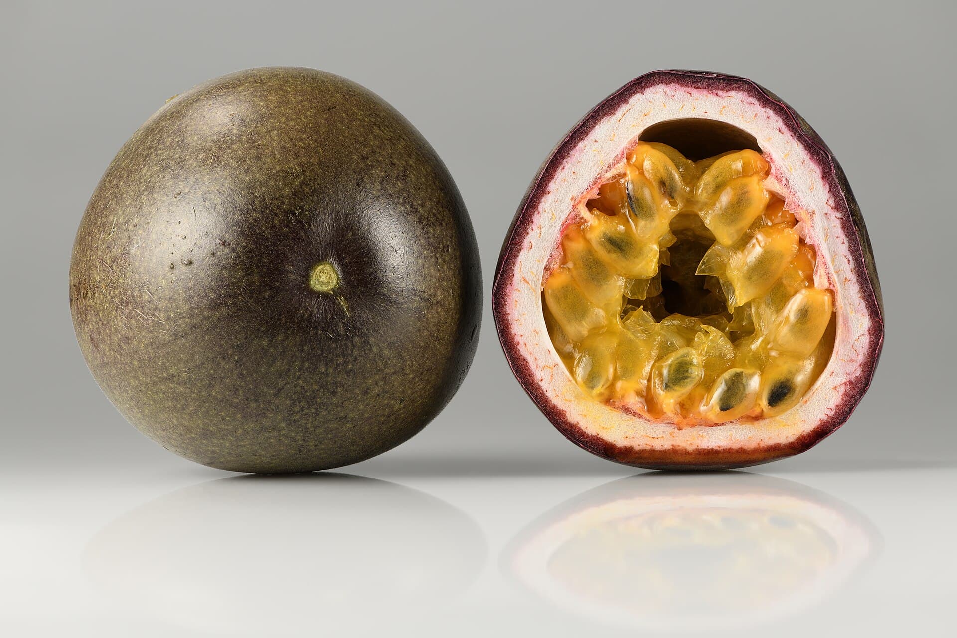 Passion fruit, whole and halved